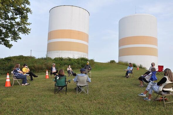 people in chairs at water towers